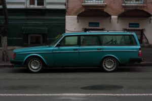 green station wagon parked on road during daytime