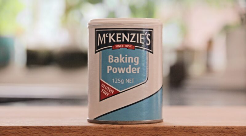 a can of baking powder sitting on a table