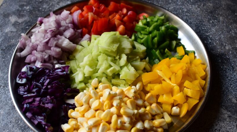 a plate of chopped vegetables on a table