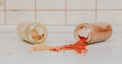 clear glass jar with red powder