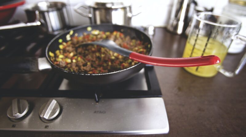Dish Cooking on Black Non Stick Pan on a Burner