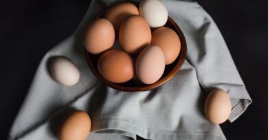beige and white eggs on brown wooden bowl