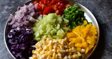 a plate of chopped vegetables on a table
