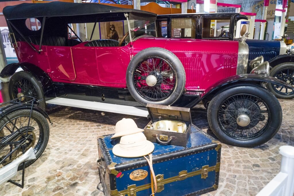 a red car with a white hat
